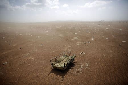 A cradle left behind by Syrian Kurdish refugees lies at the Turkish-Syrian border near the southeastern town of Suruc in Sanliurfa province September 27, 2014. REUTERS/Murad Sezer