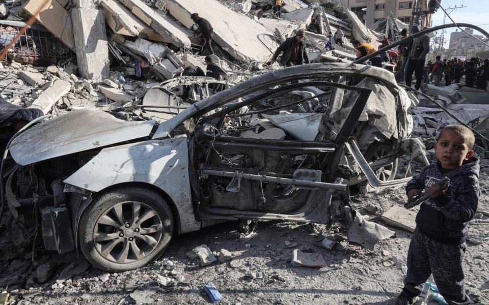 Tthe rubble of a residential building hit in an overnight Israeli air strike in Rafah