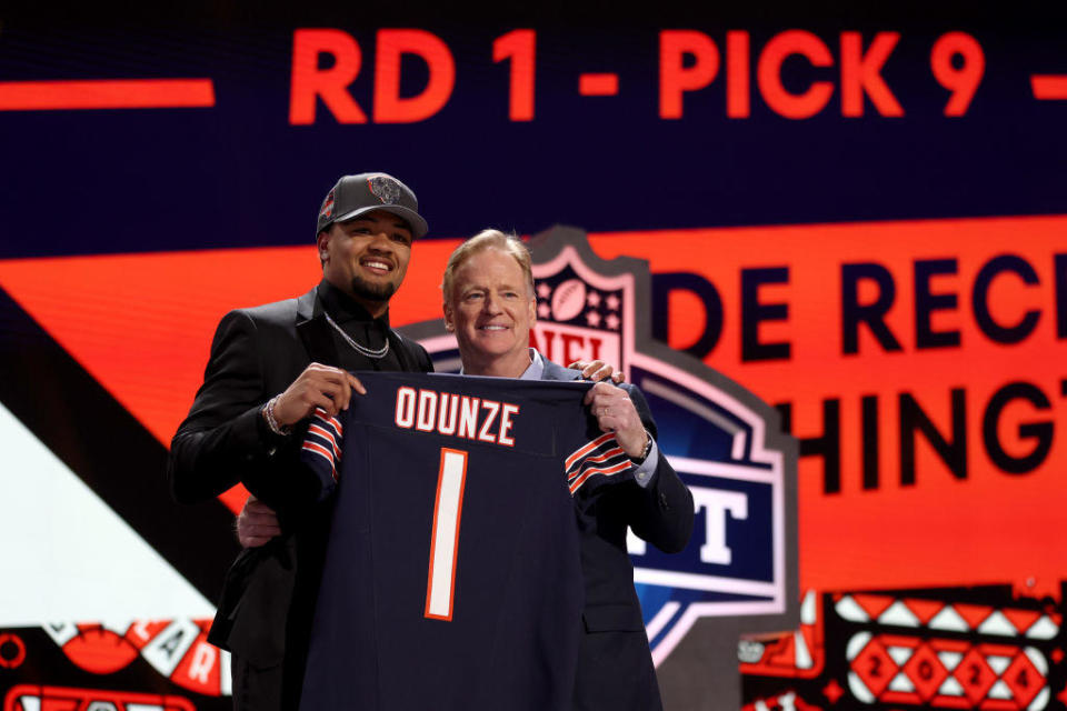 Rome Odunze poses with NFL Commissioner Roger Goodell after being selected ninth overall by the Chicago Bears during the first round of the 2024 NFL Draft at Campus Martius Park and Hart Plaza on April 25, 2024 in Detroit, Michigan. / Credit: Getty Images