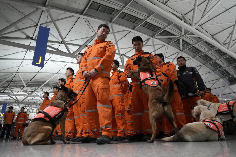 South Korean rescue team members prepare to board a plane to leave for quake-ravaged Turkey at the Incheon International Airport in Incheon, South Korea, Tuesday, Feb. 7, 2023. (AP Photo/(AP Photo/Ahn Young-joon)