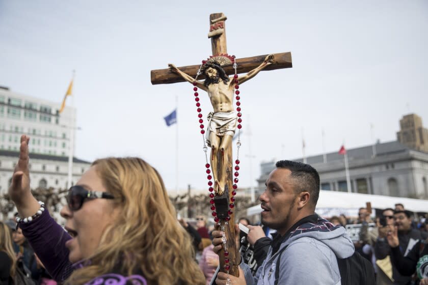 Benjamin Escalona of Salinas carries a statue of Jesus Christ on a cross while attending the annual anti-abortion Walk for Life event at Civic Center Plaza in San Francisco, Calif. Saturday, Jan. 26, 2019. (Photo by Jessica Christian/San Francisco Chronicle via Getty Images)