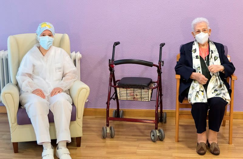 Monica Tapias and Araceli Hidalgo sit after receiving the second dose of the vaccine against COVID-19 in Guadalajara