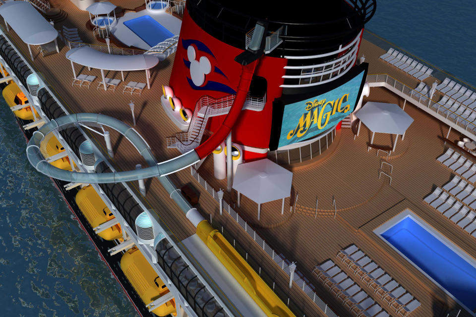 This undated image provided by Disney Cruise Line shows a rendering of how the Disney Magic ship will look when a new three-story water slide is added to the ship's exterior. Disney Magic, launched in 1998, is the oldest in Disney Cruise Line's fleet of four ships. It will get a makeover this fall when it is drydocked for a month in Spain, with changes in decor, technology and themes throughout the ship, including a new kids' area themed on Marvel Comics superheroes. (AP Photo/Disney Cruise Line)