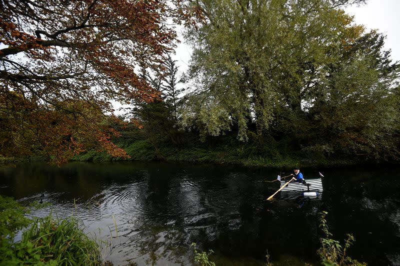 80-year old military veteran Stanley rows homemade boat named the "Tintanic" to raise funds for charity St Wilfrid's Hospice, in Chichester