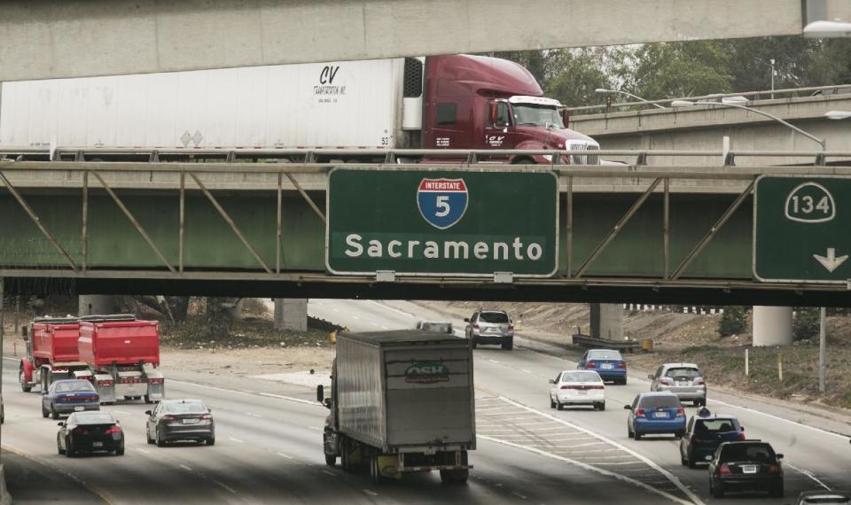 In this Thursday, Feb. 6, 2014 photo, late morning traffic travels on Interstate 5, in Los Angeles. In California, I-5 in Los Angeles County is the most congested route, according to new data from the California Department of Transportation. (AP Photo/Damian Dovarganes)