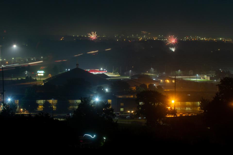 Fireworks explodes above a residential area by Burnetts Mound as smoke fills the area on July 4, 2020.