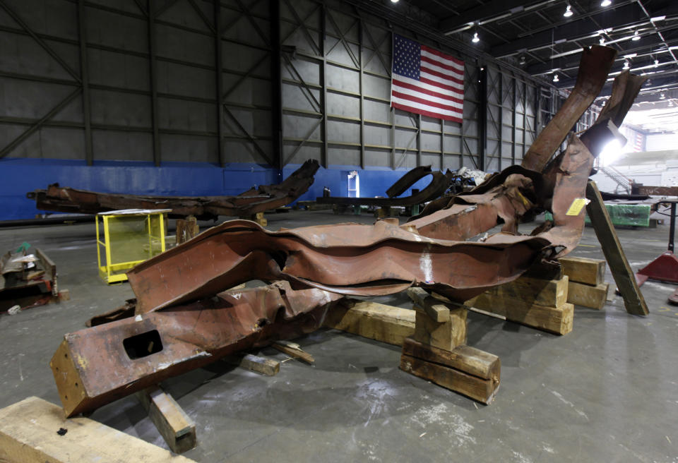 Twisted steel recovered from the World Trade Center sits inside Hangar 17 at New York's John F. Kennedy International Airport June 16, 2011. A program operated by the Port Authority of New York and New Jersey, The World Trade Center steel program, is selecting portions of the steel recovered from the Center and donating it to cities, towns, firehouses and museums around the U.S. and the world who request it for use in 911 memorial sites in time for the 10 year anniversary of the 2001 attacks. Picture taken June 16, 2011. (REUTERS/Mike Segar)