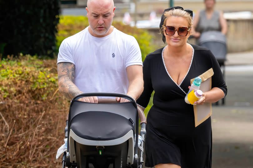 The pair were seen walking together in the sunshine as they pushed the pram down the street