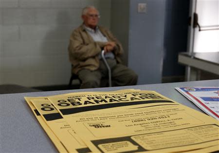 A man sits at a health insurance enrollment event in Cudahy, California March 27, 2014. REUTERS/Lucy Nicholson