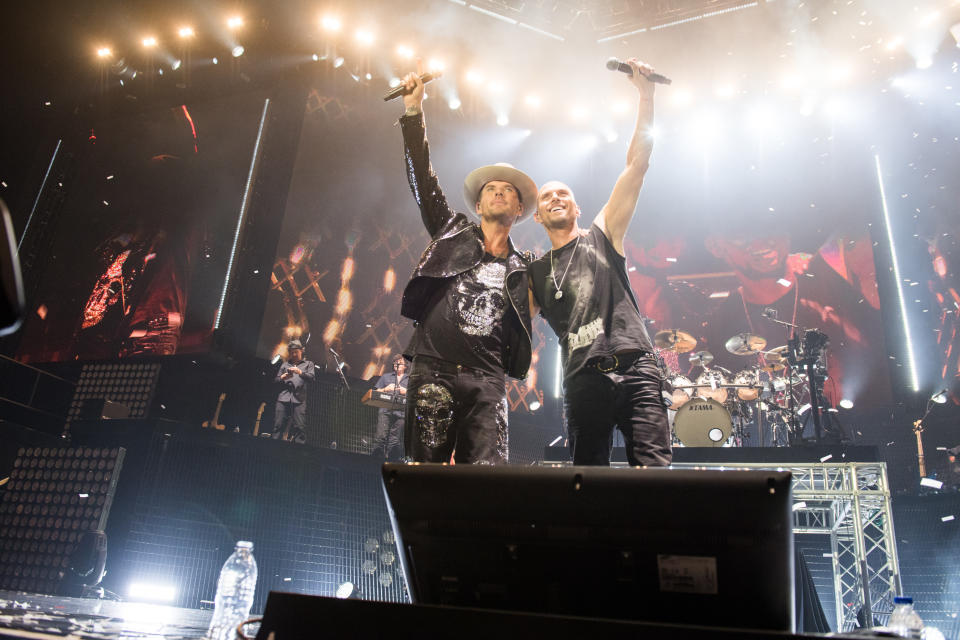 Matt and Luke Goss take a bow during their 2017 comeback gig at the O2. (Lorton Entertainment)
