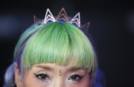 Mayup, an attendee, poses for a portrait during New York Fashion Week September 5, 2013. REUTERS/Carlo Allegri