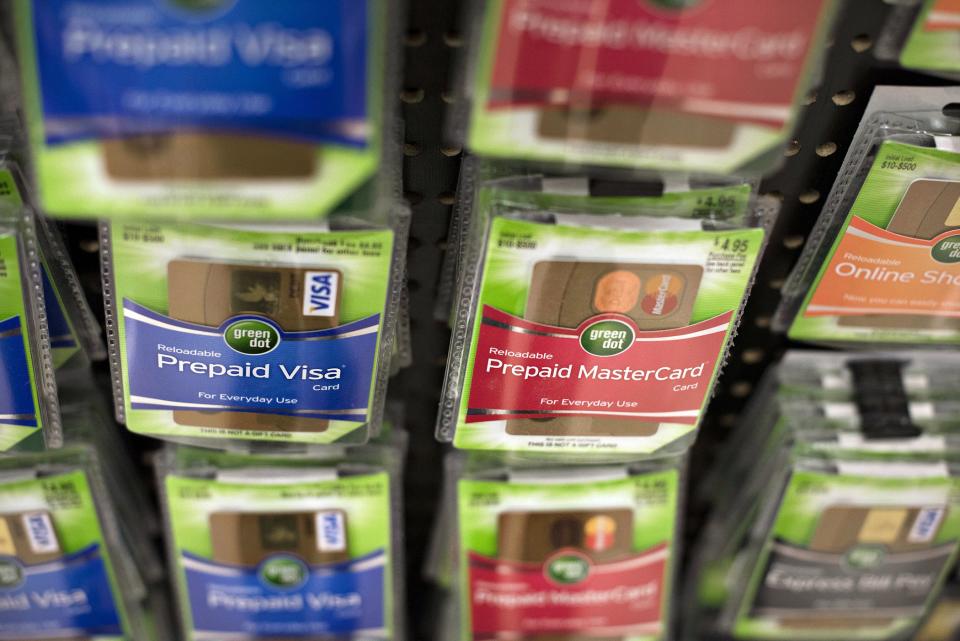 Prepaid cards on the rack at a brick and mortar location. Source: Getty via Bloomberg