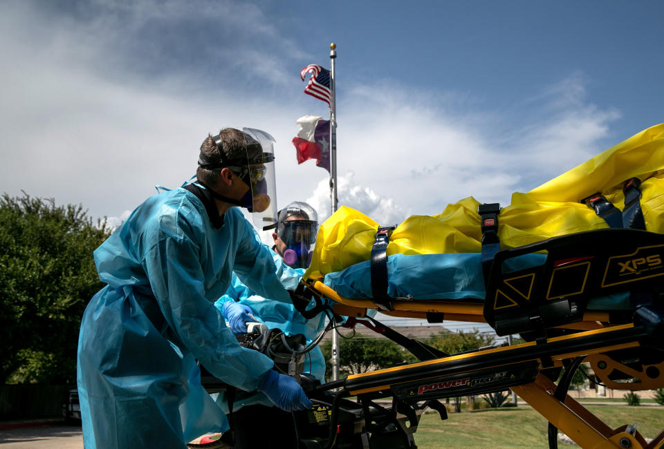 Image: Medics with Austin-Travis County EMS transport a nursing home resident with coronavirus symptoms on Aug. 3 in Austin, Texas. (John Moore / Getty Images file)