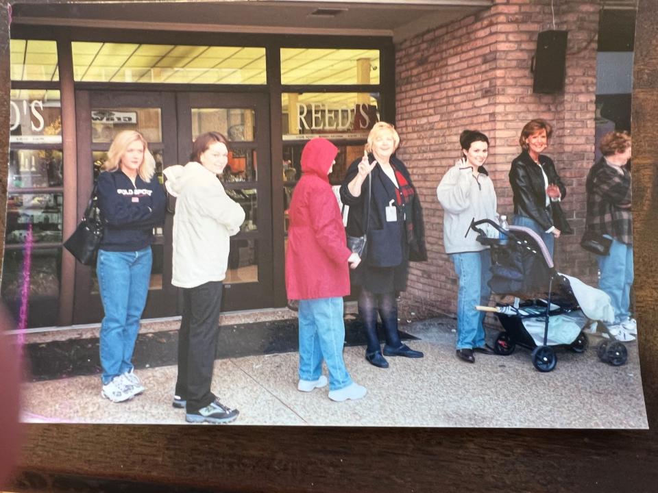 John Grisham fans stand in line outside and brave the cold and wet at Tupelo's Gumtree Bookstore in the mid 1990s, hoping to get a signed first edition of whatever his latest book of the day was.