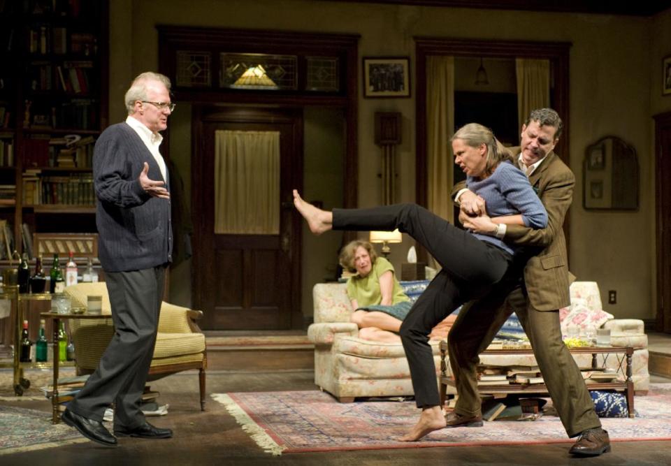 This theater image released by Jeffrey Richards Associates shows, from left, Tracy Letts, Carrie Coon, Amy Morton, foreground, and Madison Dirks during a performance of Edward Albee's Who's Afraid of Virginia Woolf, opening Oct. 13, 2012 at the Booth Theatre in New York. (AP Photo/Jeffrey Richards Associates, Michael Brosilow)