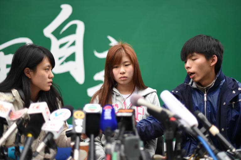 Student leaders (left to right) Prince Wong, Isabella Lo and Joshua Wong speak to the media at the pro-democracy movement's main protest site in the Admiralty district of Hong Kong, on December 3, 2014