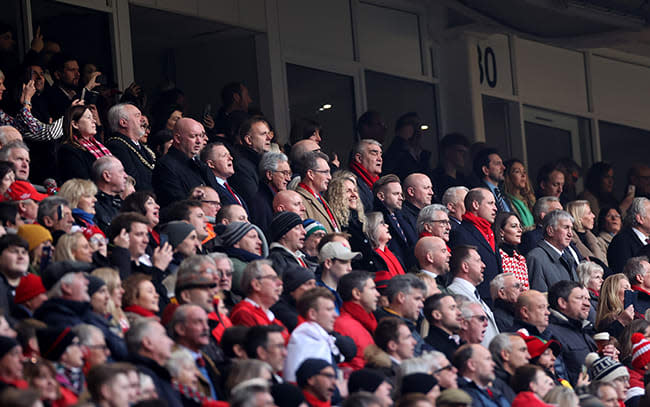 Prince William and Kate Middleton in crowd of people