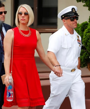 U.S. Navy SEAL Special Operations Chief Edward Gallagher leaves court with his wife after the first day of jury selection at the court-martial trial at Naval Base San Diego