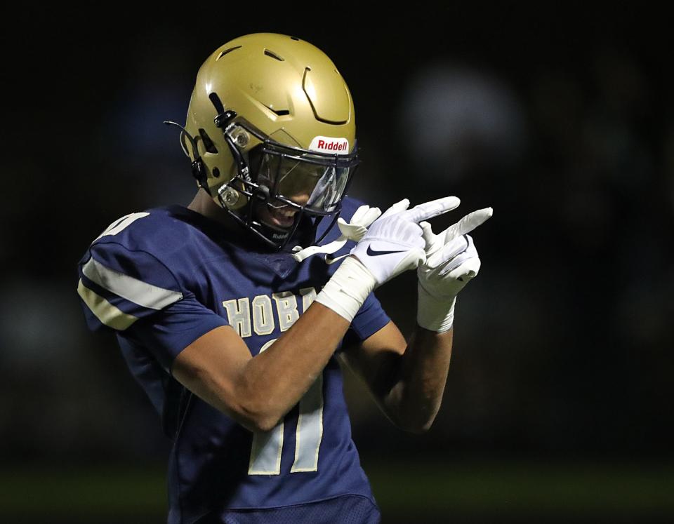 Hoban's Elbert Hill acknowledges the crowd after a touchdown against Walsh Jesuit on Sept. 29 in Akron.