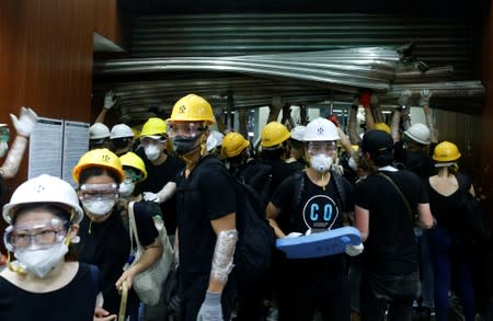 Protesters break into the Legislative Council building during the anniversary of Hong Kong's handover to China in Hong Kong