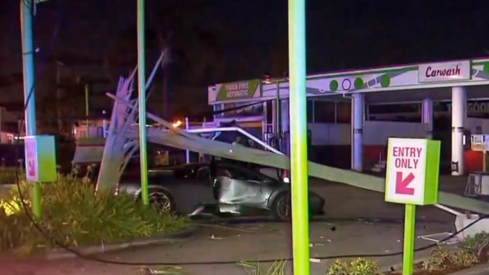 A Lamborghini crashed through a power pole at a car wash on the Gold Coast. Picture: Supplied / 7 News