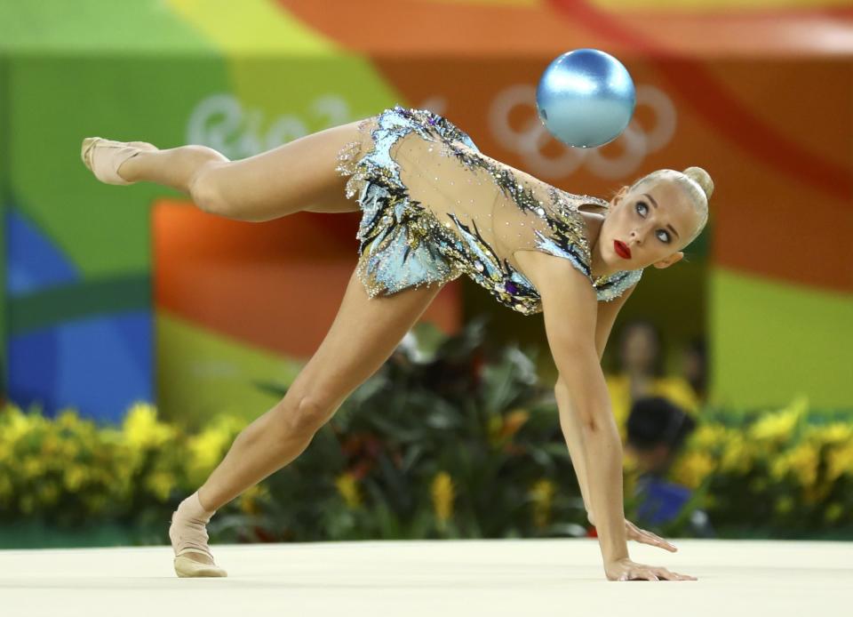 <p>Yana Kudryavtseva (RUS) of Russia competes using the ball. (Reuters) </p>