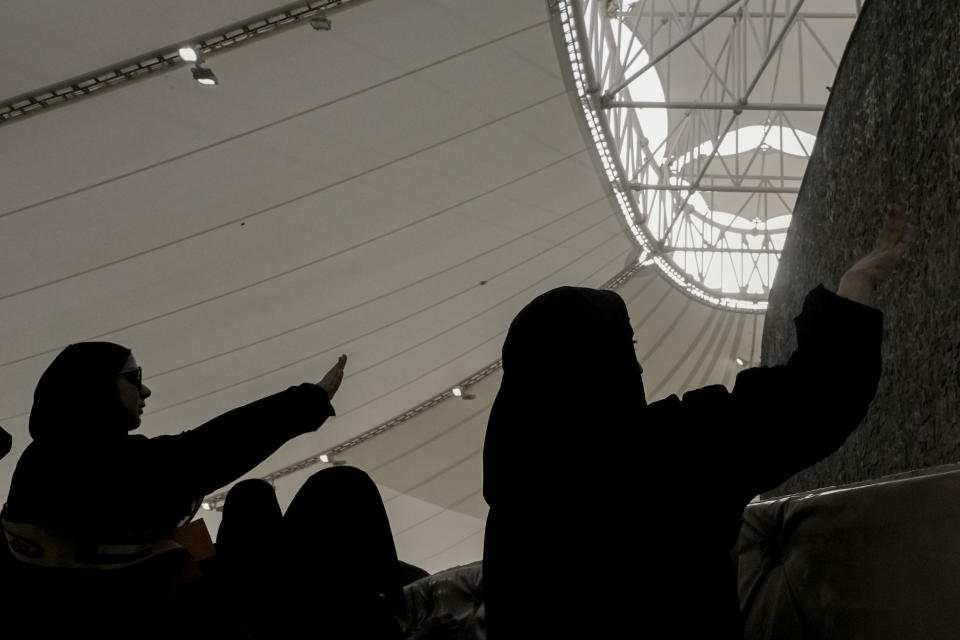 Pilgrims cast stones at a pillar in the symbolic stoning of the devil, the last rite of the annual Hajj pilgrimage, in Mina near the holly city of Mecca, Saudi Arabia, Wednesday, June 28, 2023. (AP Photo/Amr Nabil)