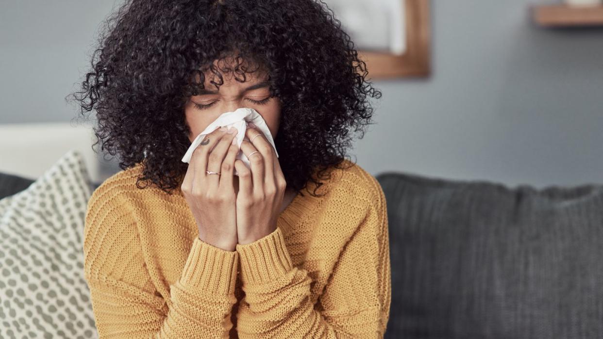 woman blowing nose