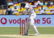 India's Cheteshwar Pujara reacts as he is hit while batting during play on the final day of the fourth cricket test between India and Australia at the Gabba, Brisbane, Australia, Tuesday, Jan. 19, 2021. (AP Photo/Tertius Pickard)