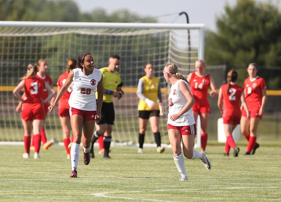 Springfield High's Kamryn Hoffman, left, celebrates after scoring the opening goal against Chatham Glenwood in the Class 2A regional final on Friday, May 17, 2024. Glenwood won 3-2.