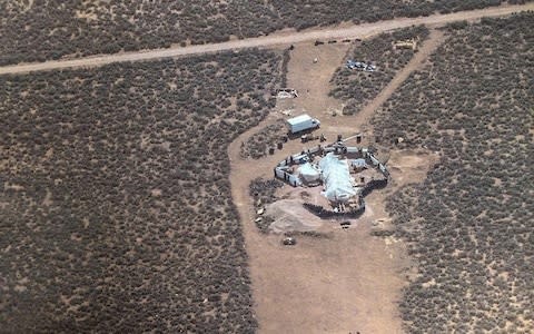 A view of the compound in Amalia, New Mexico, where police rescued 11 children and arrested two armed "extremists" - Credit: AFP