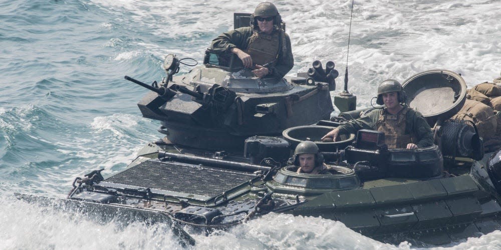 Marines aboard an amphibious assault vehicle