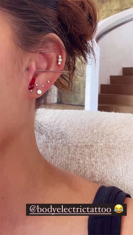 <p>Chrissy Teigen/Instagram</p> Chrissy Teigen reveals new ear piercing