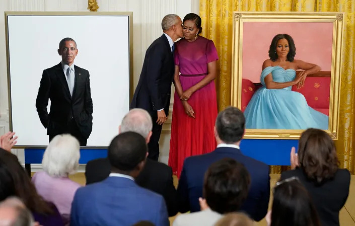 Former President Barack Obama kisses his wife former first lady Michelle Obama after they unveiled their official White House portraits during a ceremony for the unveiling in the East Room of the White House, Wednesday, Sept. 7, 2022, in Washington.