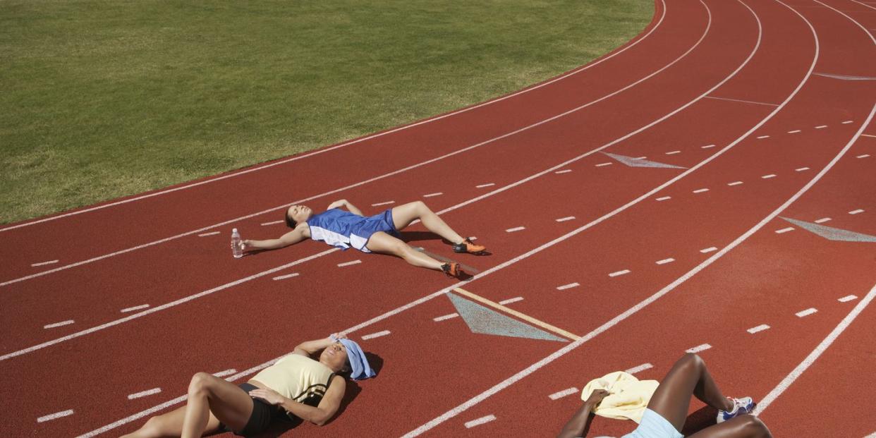 exhausted runners on track