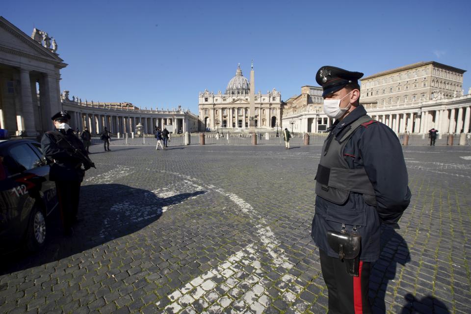 Carabineri (Italian paramilitary police officers) patrol an empty St. Peter's Square at the Vatican, Wednesday, March 11, 2020. Pope Francis held his weekly general audience in the privacy of his library as the Vatican implemented Italy’s drastic coronavirus lockdown measures, barring the general public from St. Peter’s Square and taking precautions to limit the spread of infections in the tiny city state.For most people, the new coronavirus causes only mild or moderate symptoms, such as fever and cough. For some, especially older adults and people with existing health problems, it can cause more severe illness, including pneumonia. (AP Photo/Andrew Medichini)
