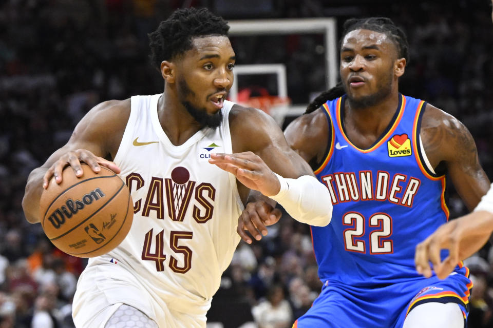 Oct 27, 2023; Cleveland, Ohio, USA; Cleveland Cavaliers guard Donovan Mitchell (45) moves against Oklahoma City Thunder guard <a class="link " href="https://sports.yahoo.com/nba/players/10107" data-i13n="sec:content-canvas;subsec:anchor_text;elm:context_link" data-ylk="slk:Cason Wallace;sec:content-canvas;subsec:anchor_text;elm:context_link;itc:0">Cason Wallace</a> (22) in the third quarter at Rocket Mortgage FieldHouse. Mandatory Credit: David Richard-USA TODAY Sports