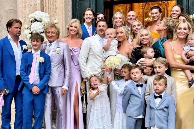 Rod Stewart, 79, poses with his eight kids as he attends son's wedding with wife Penny Lancaster