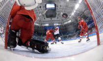 Ice Hockey - Pyeongchang 2018 Winter Olympics - Women's Semifinal Match - Canada v Olympic Athletes from Russia - Gangneung Hockey Centre, Gangneung, South Korea - February 19, 2018 - Jenn Wakefield of Canada (L) scores a third period goal past goalie Nadezhda Aleksandrova, an Olympic Athlete from Russia. REUTERS/Matt Slocum/Pool