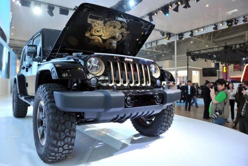 A Jeep model is displayed at the Auto China 2012 exhibition in Beijing on April 23. Automakers are rushing to cash in on China's growing passion for SUVs, with sales up five-fold in the last half-decade, as increasingly affluent urban consumers seek to showcase their wealth