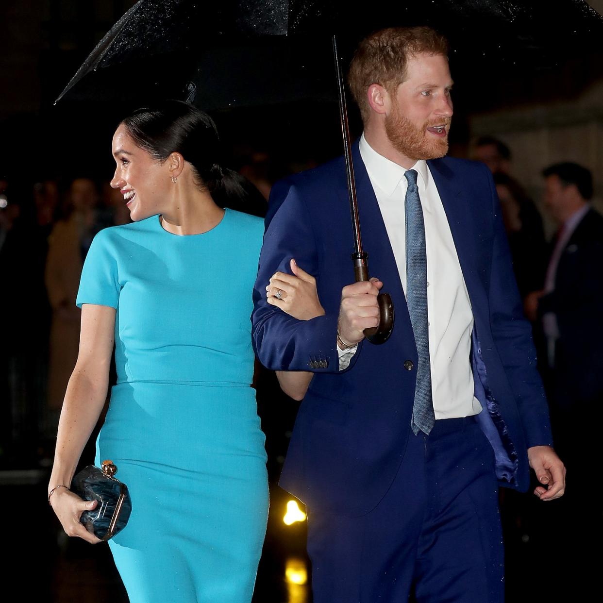  Prince Harry and Meghan Markle in March 2020 under an umbrella together 