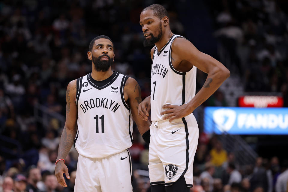 NEW ORLEANS, LOUISIANA - JANUARY 06: Kevin Durant #7 and Kyrie Irving #11 of the Brooklyn Nets react during a game against the New Orleans Pelicans at the Smoothie King Center on January 06, 2023 in New Orleans, Louisiana. NOTE TO USER: User expressly acknowledges and agrees that, by downloading and or using this Photograph, user is consenting to the terms and conditions of the Getty Images License Agreement. (Photo by Jonathan Bachman/Getty Images)