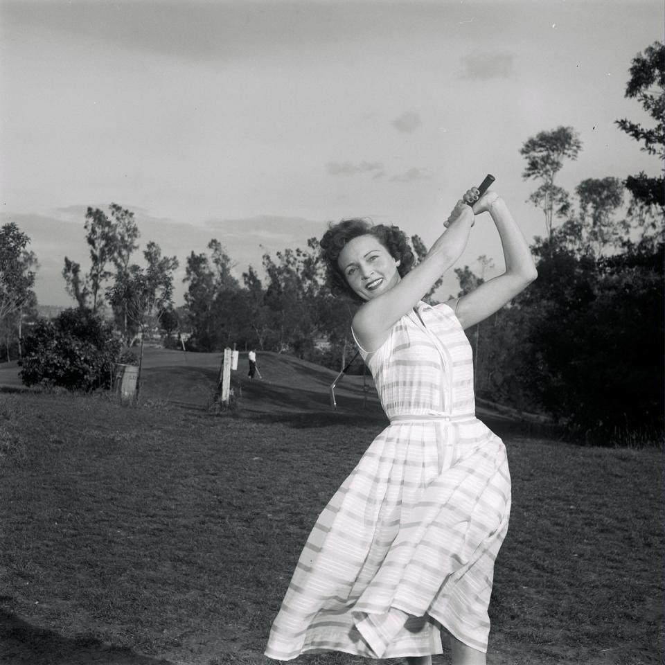 <p>White swings a golf club while on location for <em>Date with the Angels </em>in Los Angeles, California. The sitcom only lasted for 33 episodes, ending in 1958. In total, she has acted as a lead or recurring character on roughly 25 different television series. This, of course, is not counting the numerous programs where she served as host.</p>