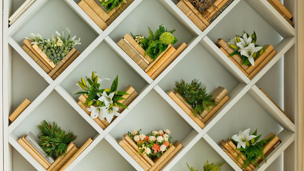 Modern spring interior with built-in bookcase .