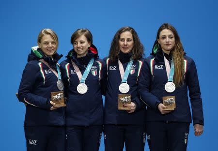 Medals Ceremony - Short Track Speed Skating Events - Pyeongchang 2018 Winter Olympics - Women's 3000 m - Medals Plaza - Pyeongchang, South Korea - February 21, 2018 - Silver medalists Arianna Fontana, Lucia Peretti, Cecilia Maffei and Martina Valcepina of Italy on the podium. REUTERS/Kim Hong-Ji