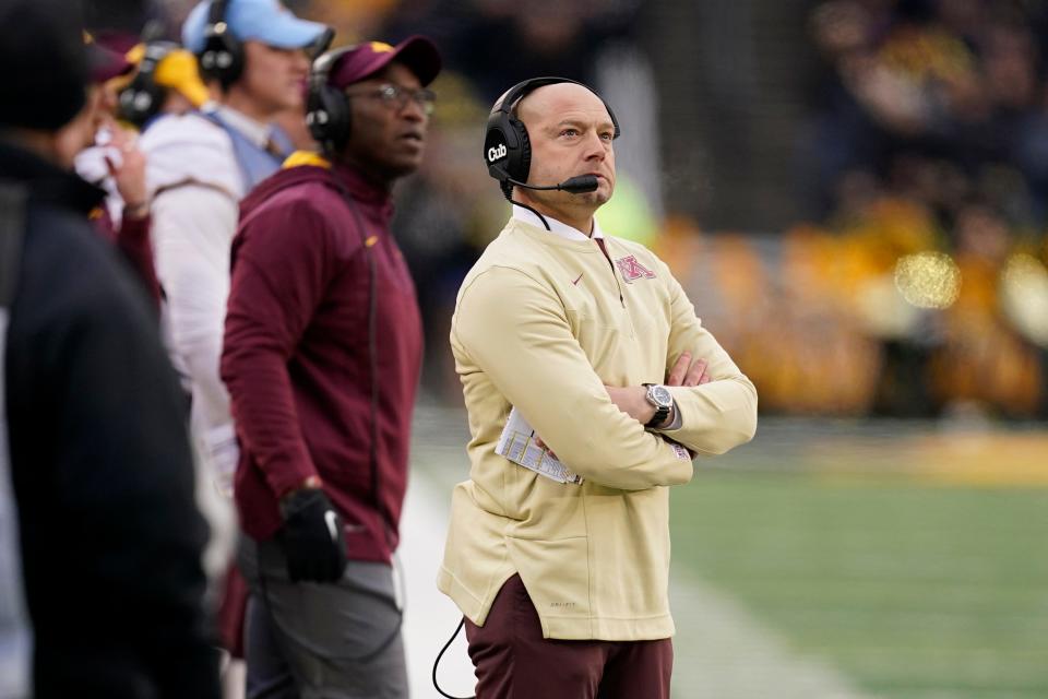Minnesota head coach P.J. Fleck watches from the sideline during the first half of an NCAA college football game against Iowa, Saturday, Nov. 13, 2021, in Iowa City, Iowa. (AP Photo/Charlie Neibergall) ORG XMIT: IACN110