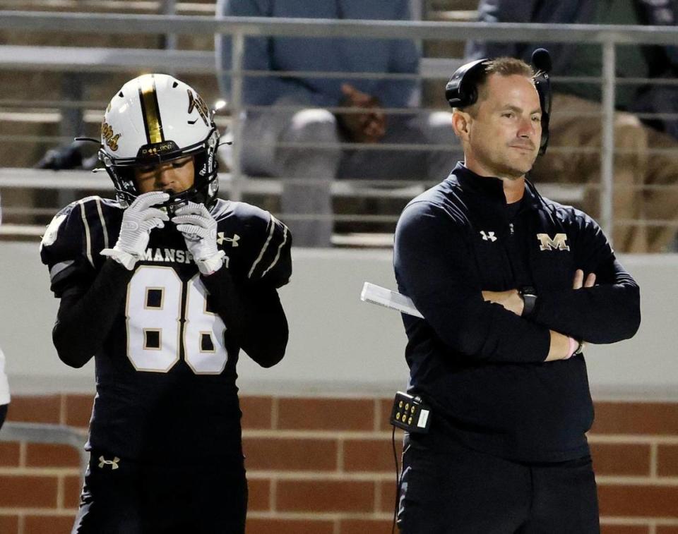 Mansfield head coach Greg George watches the final seconds next to wide receiver Braden Barnett (86) in the second half of a UIL high school football game at Vernon Newsom Stadium in Mansfield, Texas, Thursday, Oct. 12, 2023.