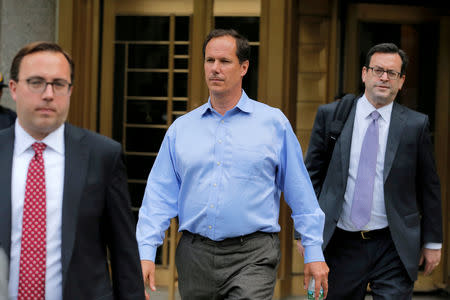 FILE PHOTO: Ted Huber (C), employee of the healthcare investment fund Deerfield Management, departs Federal Court in Manhattan after an arraignment for insider trading in New York, U.S., May 24, 2017. REUTERS/Lucas Jackson/File Photo