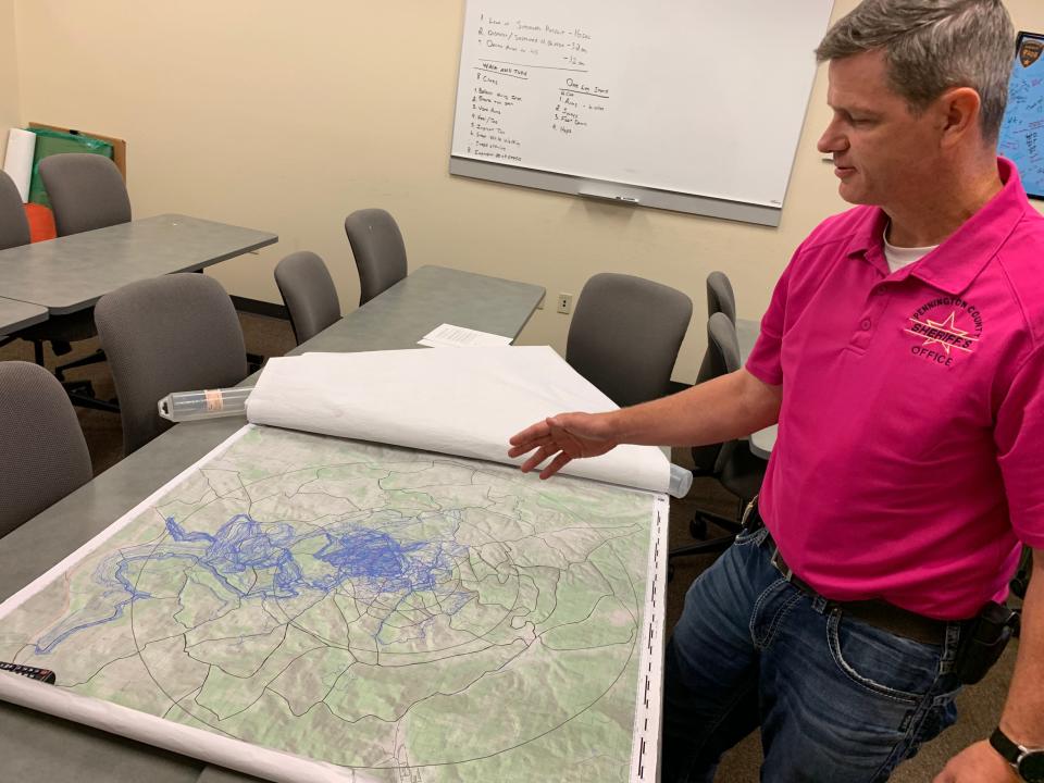 Pennington County Sheriff’s Captain Tony Harrison, now retired, examines search maps during the investigation into the 2019 disappearance of Serenity Dennard.