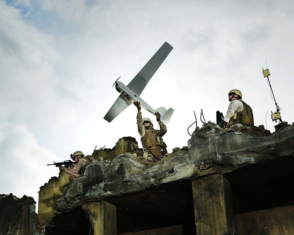 A soldier prepares to launch an AeroVironment Puma AE drone.